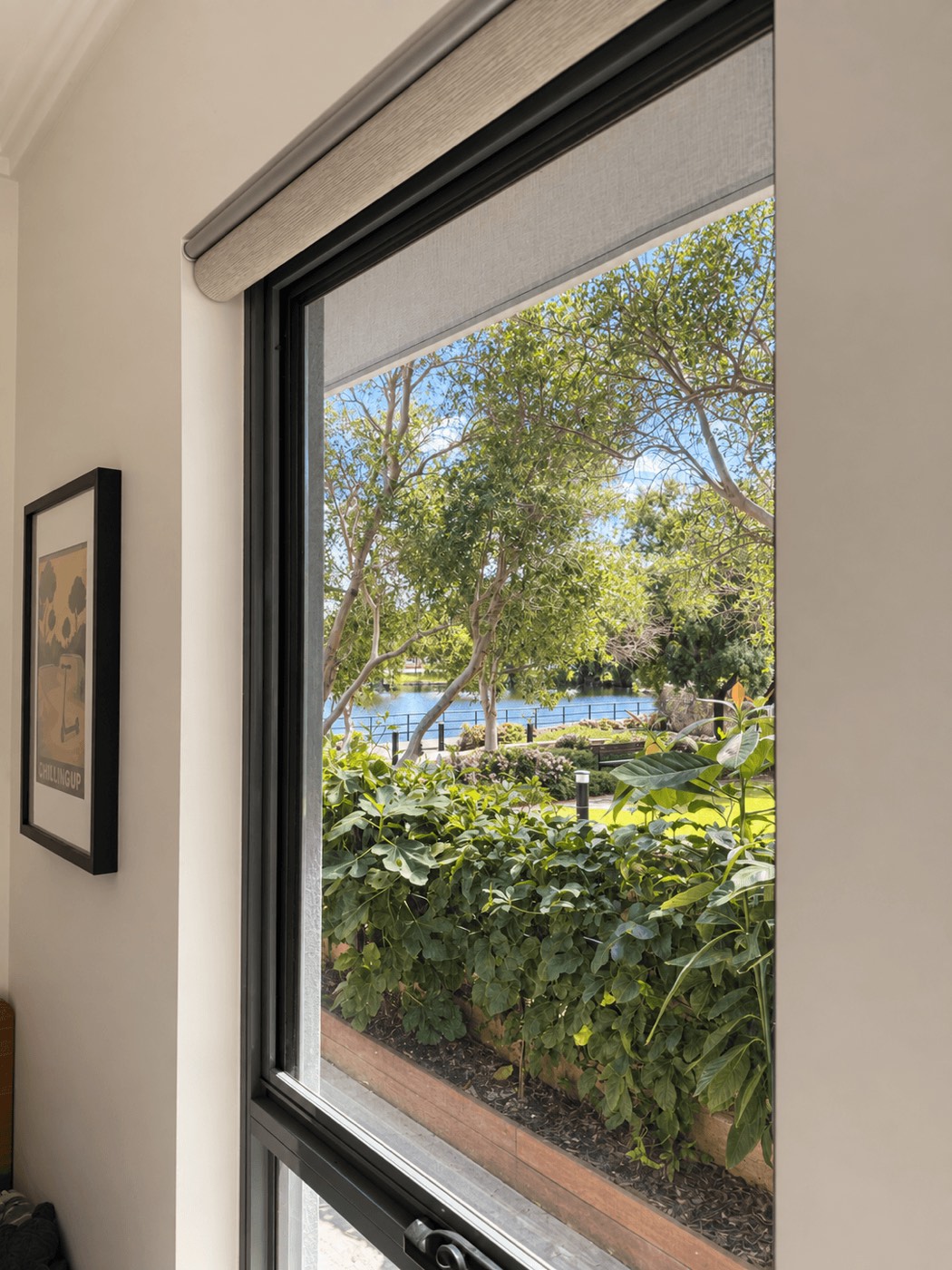 The lake and garden seen through a bedroom window.